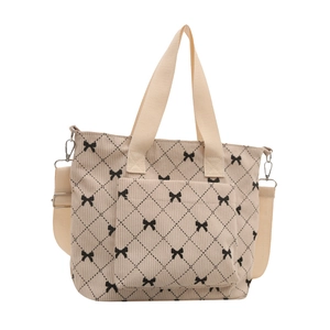 Sac fourre-tout chic en velours beige avec nœuds noirs et bandoulière réglable