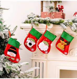 Detail of Christmas stocking set with 3D Santa and Reindeer on festive mantel decor