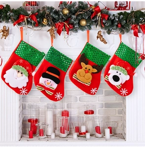 Mini Christmas stockings with sequin trim and 3D cartoon figures hanging on a mantelpiece