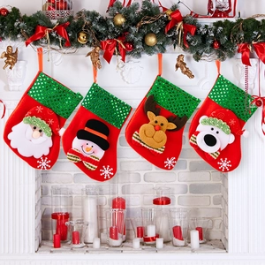Set of 4 Christmas stockings with green sequins and 3D Santa reindeer patterns hanging on mantel