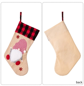 Detailed front and back views of burlap Christmas gnome stockings with red plaid cuffs