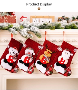 Set of 4 mini Christmas stockings with 3D cartoon characters on a cozy white fireplace
