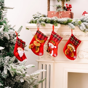 Set of 4 Christmas stockings with Santa, reindeer, snowman, and bear patterns on plaid cuff