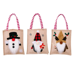 Three-piece Christmas gnome burlap gift bags with buffalo plaid and striped handles