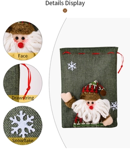 Detail display of Christmas linen gift bag showing Santa patch, drawstring and snowflake