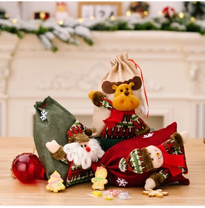 Three burlap Christmas gift bags with Santa, elk, and snowman 3D plush figures