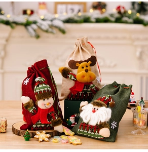 Three 3D cartoon burlap Christmas drawstring bags with Santa, Reindeer and Snowman designs