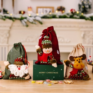 Christmas burlap gift bags with 3D Santa, Snowman, and Reindeer dolls for holiday decor
