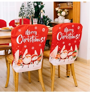Detail of red Merry Christmas chair covers featuring festive cartoon characters and snowflakes