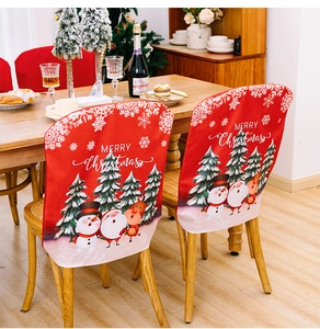 Close-up of red Christmas chair cover featuring Santa Claus and Merry Christmas text