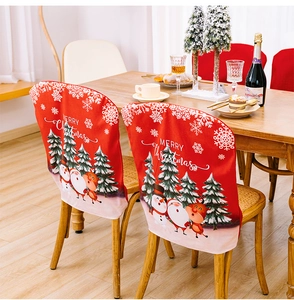 Detail of red Merry Christmas chair cover with Santa, reindeer and snowflake patterns