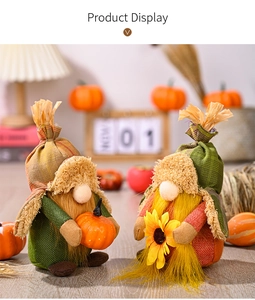 Detail of harvest gnomes featuring sunflower and pumpkin props with plaid hats