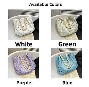 Detail view of four color options for the pleated tote bag featuring small bow prints