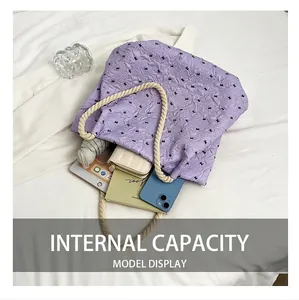 Spacious interior of lavender tote bag holding tablet, umbrella, and accessories
