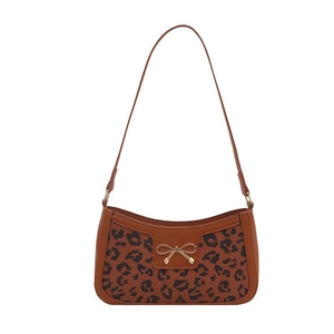 Brown baguette shoulder bag featuring leopard print panel and golden bow detail