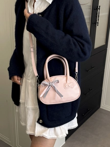 Bolso bandolera rosa con lazo decorativo y diseño en relieve para mujeres