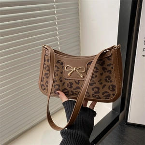 Retro leopard print shoulder bag with crocodile texture and gold bow detail