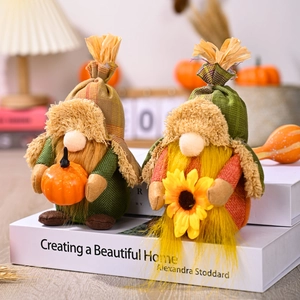Fall harvest gnomes set with pumpkins and sunflowers for autumn home decoration