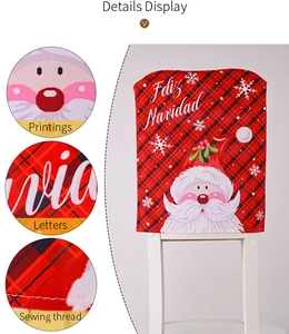 Detail showing high-quality Feliz Navidad print and red black plaid stitching on chair cover