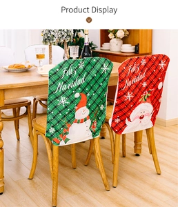 Detail view of red and green Christmas chair covers with Santa and snowman patterns