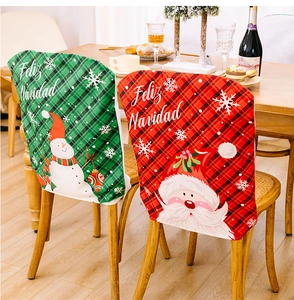 Close-up of red and green plaid Christmas chair covers with snowman and Santa patterns
