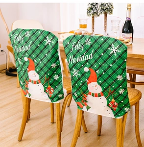 Green plaid Christmas chair cover with snowman print and Feliz Navidad greeting text