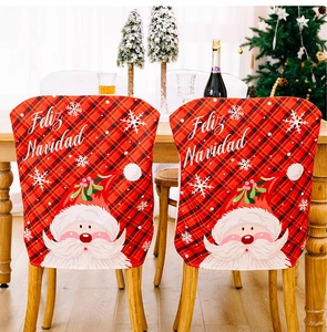 Detail of red plaid Christmas chair cover with Santa Claus and Feliz Navidad print