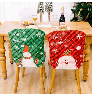 Detail of Christmas chair covers with snowman and Santa patterns for festive home decor