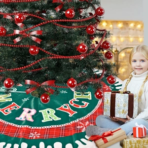 Green Christmas tree skirt with red plaid border, white snowflakes and Merry text design