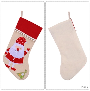 Front and back detail of burlap Christmas stocking featuring Santa Claus and plush balls