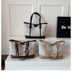 Minimalist canvas tote bags with leather trim displayed in black, brown and khaki colors