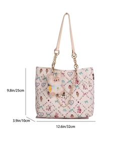Cream cartoon tote bag with bear print, pearl chain, and plush doll on white background