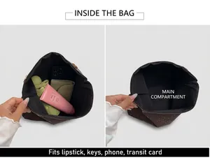 Detail view of a spacious dark brown tote bag interior with everyday essentials inside