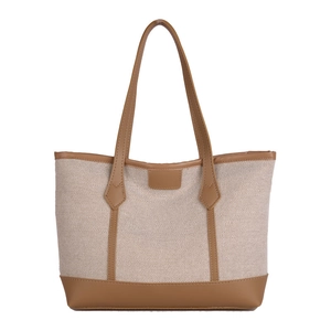 Contrast canvas and leather tote bag with brown handles in a spacious commuter design