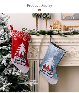 Macro view of Christmas stockings with gnome prints hanging on a white fireplace mantle