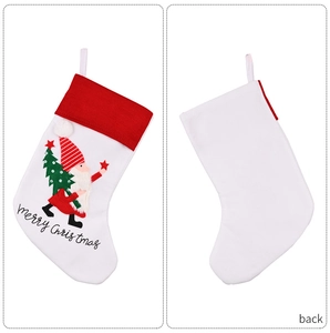 Detail of Christmas stocking featuring gnome embroidery and merry Christmas text