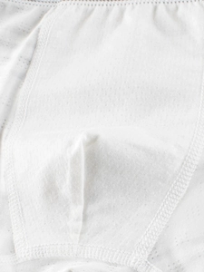 Close-up of white breathable mesh fabric and reinforced stitching for boys' underwear