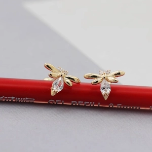 Minimalist dragonfly stud earrings in gold finish with sparkling zircon inlay details
