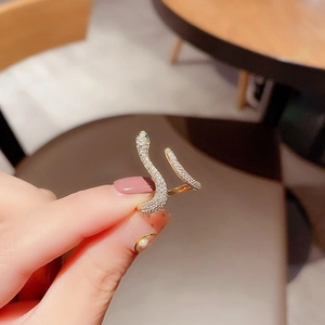 Adjustable gold snake ring with white zircon pave and green gemstone eyes for women