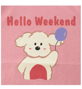 Detail of pink cotton tee showing a cute cartoon puppy and Hello Weekend print