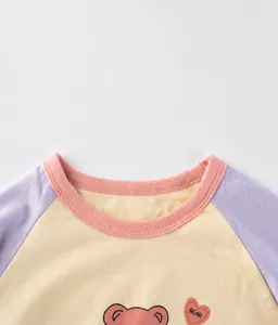 Close-up of color-block crew neck and cute bear print on kids long sleeve cotton t-shirt