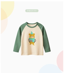 Detail of girls' long sleeve cotton t-shirt with cute cartoon bear print and raglan sleeves