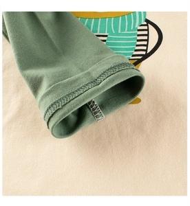 Close-up of the contrast sleeve cuff with neat stitching on girls cotton bear t-shirt