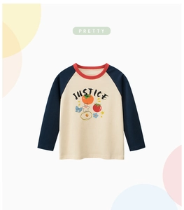 Detail of girls' raglan sleeve tee with JUSTICE print and colorful cartoon icons