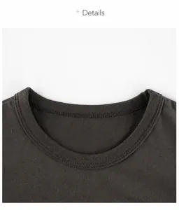 Detailed close-up of dark grey cotton t-shirt neckline with reinforced stitching