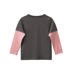 Detail view of the back of a kids' long-sleeve T-shirt with grey and pink patchwork