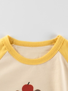 Kids long sleeve crewneck cotton T-shirt with yellow raglan sleeves and fruit pattern