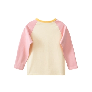Detail of kids long sleeve raglan T-shirt in pale yellow with pink sleeves cotton fabric