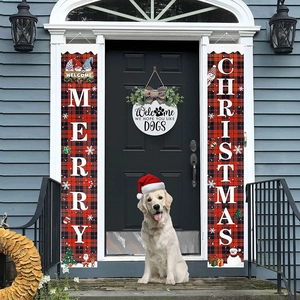 Red plaid Merry Christmas banners with wooden welcome dog sign on a navy blue door