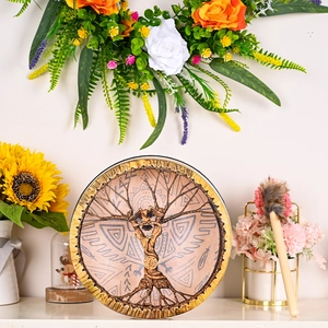 Detail of Shaman drum featuring Tree of Life pattern and matching mallet with floral decor